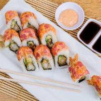 Dolphins Roll · Shrimp tempura, avocado, spicy mayo, scallions topped with spicy tuna and seeds.