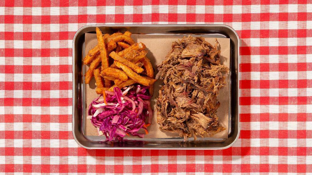 Pulled Pork Sandwich · Smoked pulled pork with coleslaw and bbq sauce on a bun.