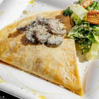Creamy Mushrooms & Chicken Crepe · Roasted chicken, spinach and Parmesan cheese with a Cesar salad on the side.
