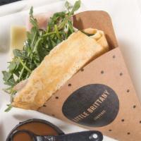 Traditional Crepe · Cheese and York ham with baby arugula and classic dressing.