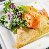 Marina Crepe · Smoked salmon, shrimp, red onion, baby capers, mix greens, and lemon cream cheese dressing.