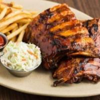 World-Famous Baby Back Ribs - Full Rack · Tender baby back ribs triple basted in Original BBQ Sauce. Served with your choice of side.