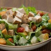 Chicken Caesar Salad · Roasted chicken breast, romaine, roasted tomatoes, croutons and Asiago cheese. Tossed in bas...