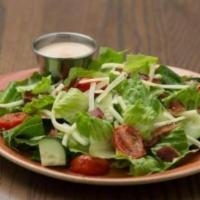 House Chop Side Salad · Romaine blend, topped with bacon, cucumber, roasted tomatoes, and cheddar cheese. Served wit...