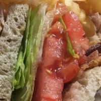 Roast Turkey Triple Decker Club · Bacon, lettuce and tomato. Served with choice of fries or potato salad.