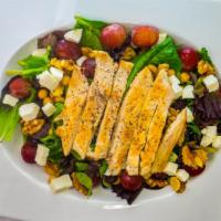 Signature Salad · Fresh baby spinach, red grapes, dried cranberries, walnuts, chick peas, gorgonzola cheese an...