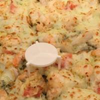 Seafood Pizza · Shrimp, Crab meat, and fresh Roasted Garlic on top of our delicious Pesto Sauce.