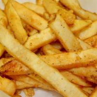 French Fries · Golden straight cut French fries, served with a side of ketchup.