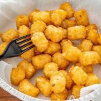 Tater Tots · Bite sized balls of hash heaven, perfectly fried for a crispy outside and tender inside. Ser...