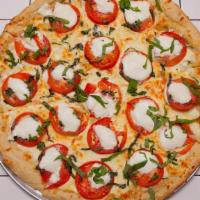 Small Caprese Pizza · Fresh buffalo mozzarella cheese, ripe tomatoes, topped with fresh basil. No sauce.