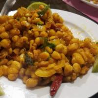 Chilli Pepper Corn · Baby corn coated with batter, cooked in Indo-Chinese style.