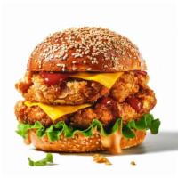 Bbq Chicken Sandwich · Delicious sandwich served on a toasted bun and topped with crispy fried chicken, onion rings...
