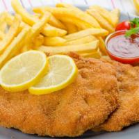 Beef Milanesa · Breaded steak (Argentinian style milanesa) with French fries.