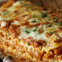 Lasagna · Classic lasagna with ground beef and Italian tomato sauce.