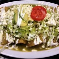 Enchiladas Verdes De Pollo (Hot) · Green spicy salsa filled with chicken and topped with lettuce, Mexican fresh cheese, sour cr...