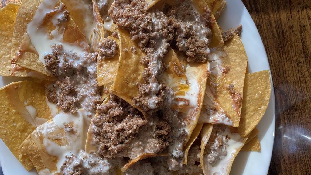 Ground Beef Nachos · Only Beef, Cheese Dip, And Chips