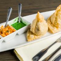 Vegetable Samosas (2 Pieces) · Triangular puffed pastry stuffed with cubed potatoes, green peas, carrots, and mildly spiced...