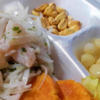 Ceviche Playero (Tradicional Peruano) · Marinated fish in our Leche de Tigre mixed with onions and cilantro.