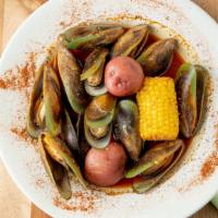 Green Mussels · Per pound. Seafood comes with corn and potato.