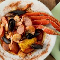 Juicy Seafood Special # 7 · One cluster of snow crab, half pound mussels, half pound shrimp, quarter pound sausage, corn...