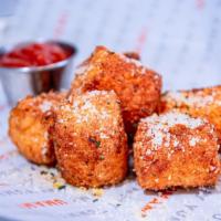 Cheesy Potato Tots · Hand breaded and deep fried potato tots filled with our signature three cheese blend, topped...