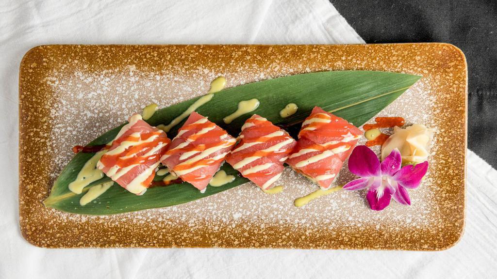 Lava Roll · Spicy. Spicy tuna, avocado, tempura crunch, wrapped with tuna, wasabi mayo, sweet chili sauce.