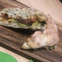Panino Vegana · Homebaked sourdough bread toasted, sundried tomato paste, avocado, cucumber, spinach, and ar...
