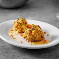 Sizzling Blue Crab Cakes · Two jumbo lump crab cakes with sizzling lemon butter