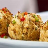Sizzling Blue Crab Cakes · Three jumbo lump crab cakes with sizzling lemon butter