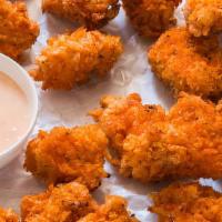 Popcorn Chicken · Bite-sized pieces of breaded fried chicken. Choose a sauce.