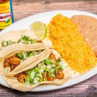 3 Tacos Desayuno Tortillas De Harina · Three breakfast Tacos on flour tortillas. Your choice of egg styles. Come with beans. Rice i...
