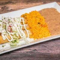 Falutas De Pollo Con Arroz Y Frijoles · Three fried rolled tortillas stuffed with chicken with rice and beans.