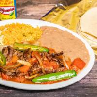 Bistec A La Mexicana · Mexican style steak with rice and beans.

**spicy, may request without Jalapenos