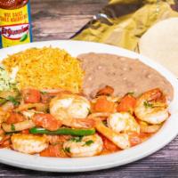 Camarones A La Mexicana · Mexican style shrimp sauteed in tomato sauce, onion, and jalapeno peppers with rice and bean...