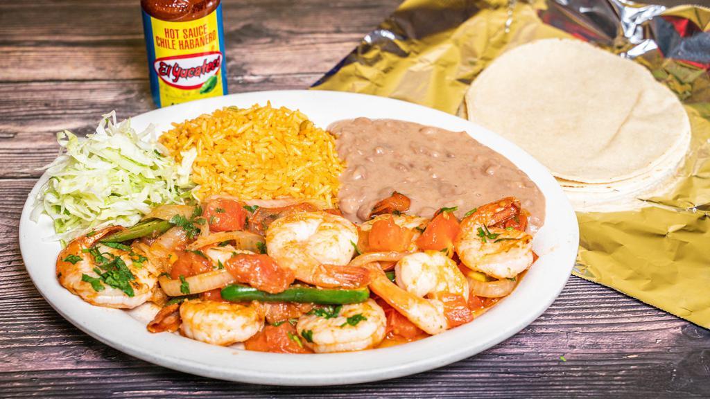 Camarones A La Mexicana · Mexican style shrimp sauteed in tomato sauce, onion, and jalapeno peppers with rice and beans.

*Spice, may request without Jalapeno
