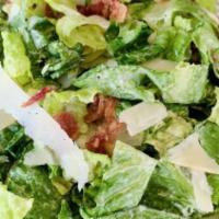 The Caesar Rustic Bread Salad · Rustic bread with romaine lettuce with bacon, croutons, shaved Parmesan cheese, and Caesar d...