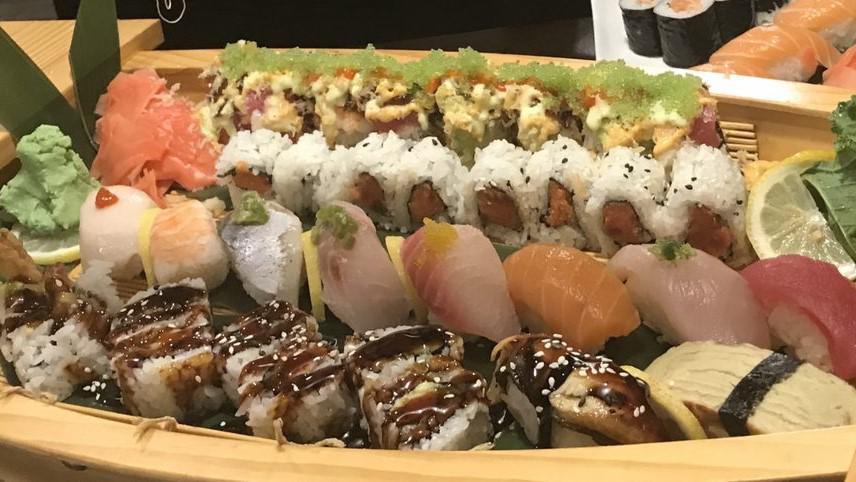 Love Boat For Two · Shrimp tempura roll, angel roll, spicy tuna roll, 10 pieces of chef's choice sushi served with  soup and  salad.