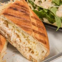 Asiago Chicken Panini · Savory Asiago spread, shredded chicken topped with Parmesan cheese on a Bolillo roll.