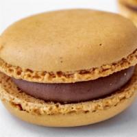Caramel Macaron · A soft caramel flavored base filled with smooth caramel cream for an overall chewy texture.