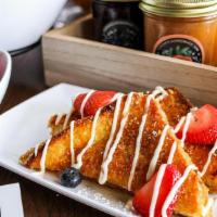Gocha’S Krunch-Tastic · Crunchy battered French toast with mixed berries powdered sugar and our house vanilla bean s...