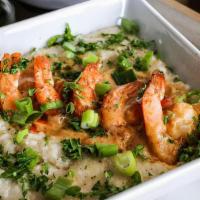 Shrimp And Grits · Sautéed shrimp in Gocha’s tasty creamy herb sauce served over rich creamy grits garnished wi...