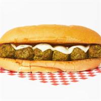 The Meatball Pesto Sub · Our house meatballs with fresh basil pesto sauce and melted mozzarella cheese on a hoagie ro...
