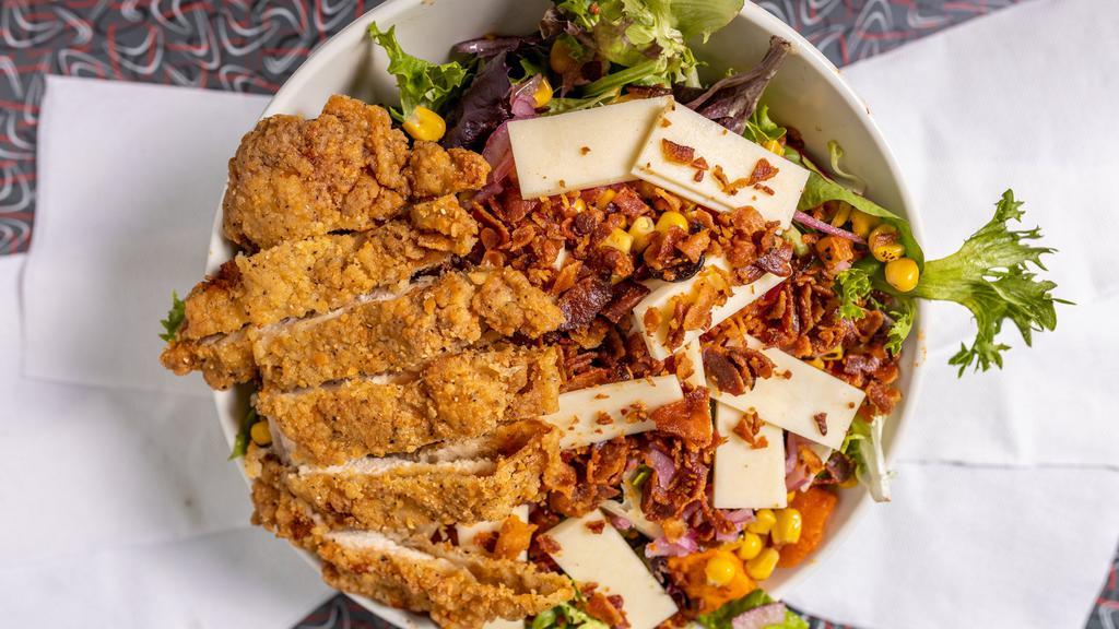 Southern Crispy Chicken · 910 cal. Crispy chicken, roasted sweet potato, roasted tomatoes, chopped bacon, roasted corn, pickled onions, and smoked cheddar all tossed with mixed greens and smokey-vinaigrette.
