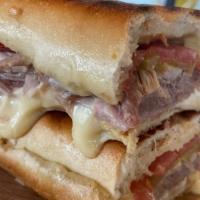 Cuban Media Noche Sandwich · Media noche bread, roasted pork, ham, swiss cheese, pickles and dijon mustard