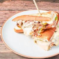 Philly Cheese Steak Sandwich · Baguette, philly steak, provolone cheese, onions, green pepper