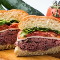 Al’S Big Ass Roast Beef · Thinly sliced rare roast beef, Swiss cheese, lettuce and tomato served on a kaiser roll with...