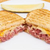 Real Reuben · Lean sliced corned beef, sauerkraut and Swiss cheese served hot on toasted rye with russian ...