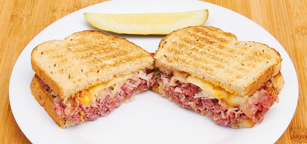 Real Reuben · Lean sliced corned beef, sauerkraut and Swiss cheese served hot on toasted rye with russian dressing.