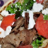 Gyro · Grilled Beef & Lamb Gyro with fresh lettuce, tomato, onion, topped with feta cheese and tzat...