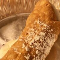 Cannoli · Italian pastry filled with sweet cream, Ricotta, and chocolate chips.